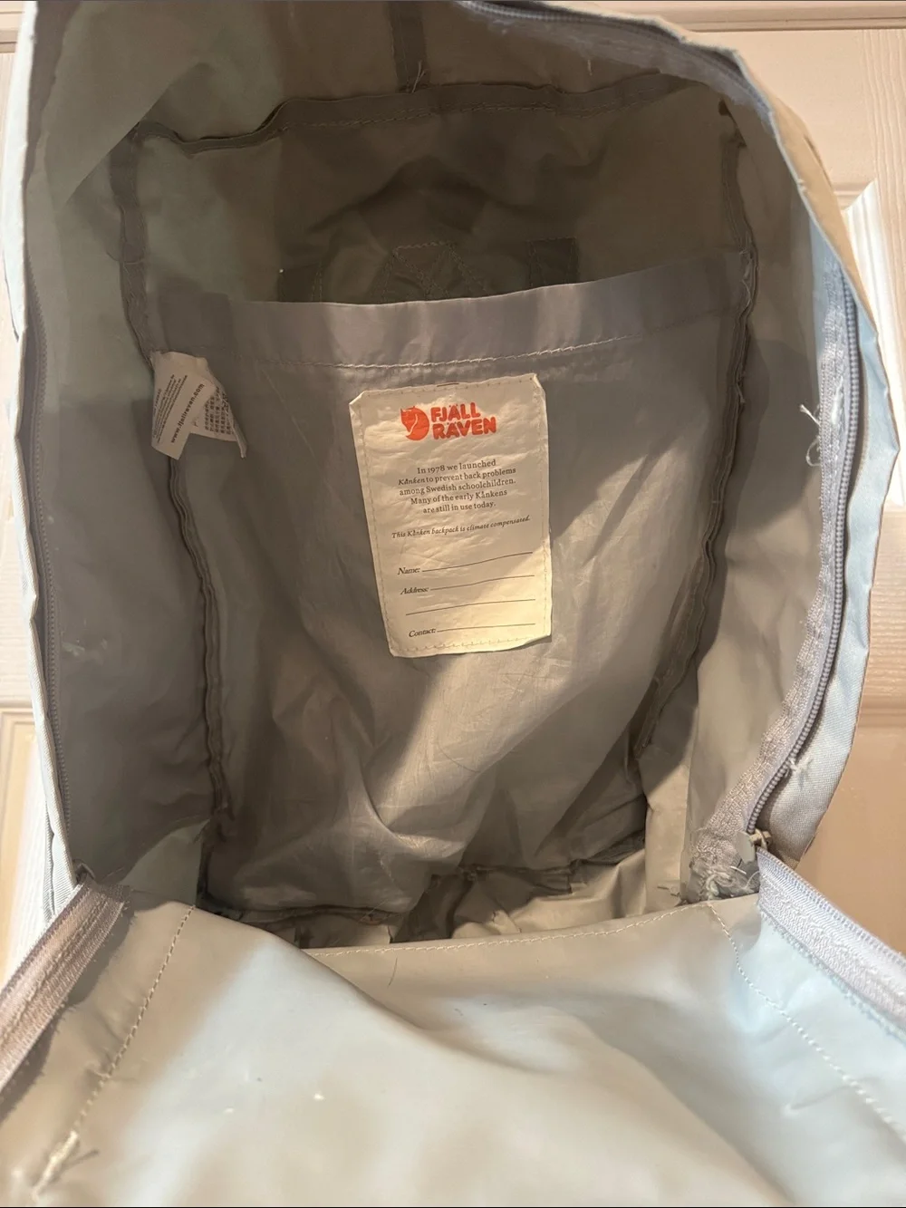 Fjallraven Kånken Backpack in Light Gray with Red Logo